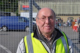 Manning the pedestrian gate with a smile